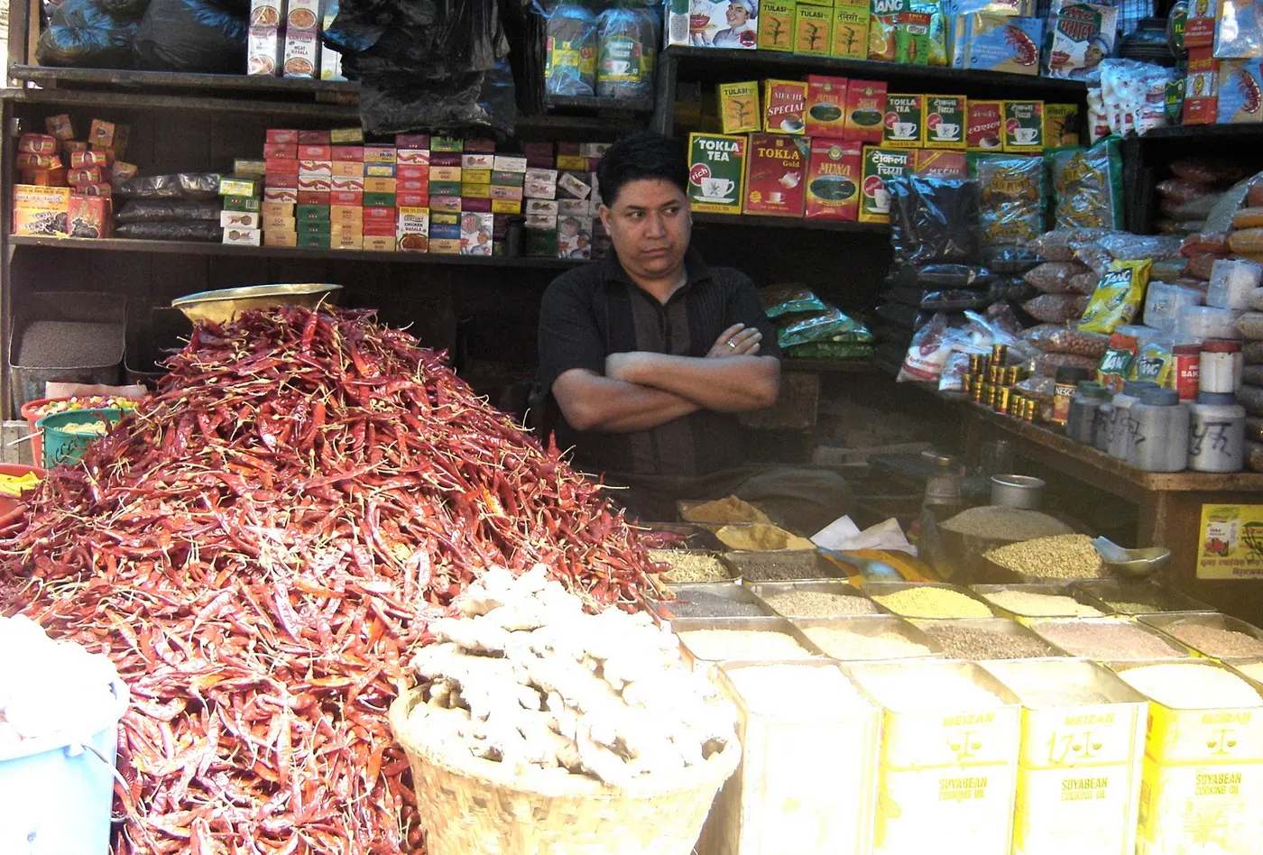 Huge pile of red dried chili pepper in front of the store along with other Nepali spices. The picture was taken near Maru Tole, in the heart of Kathmandu.