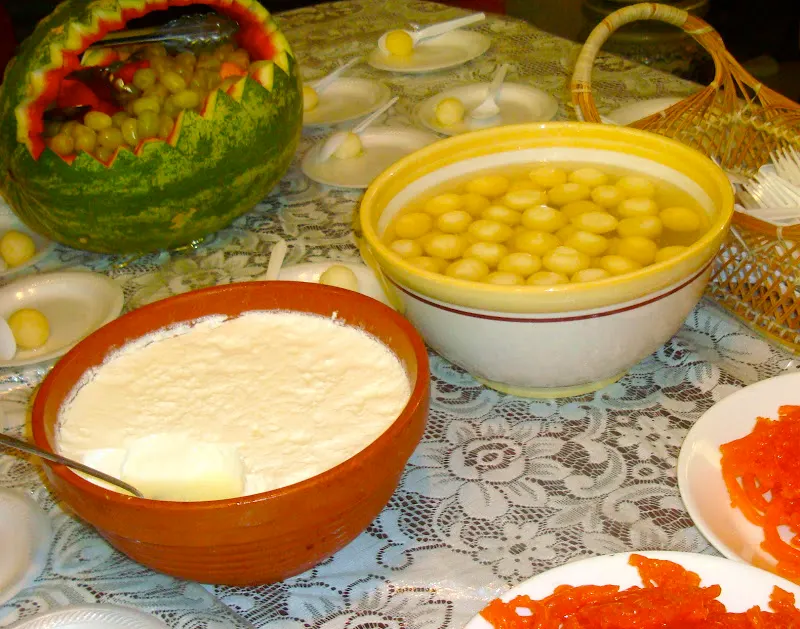 Serving delicious home-made Juju Dhau at Shanti's place during special vhoye (feast).