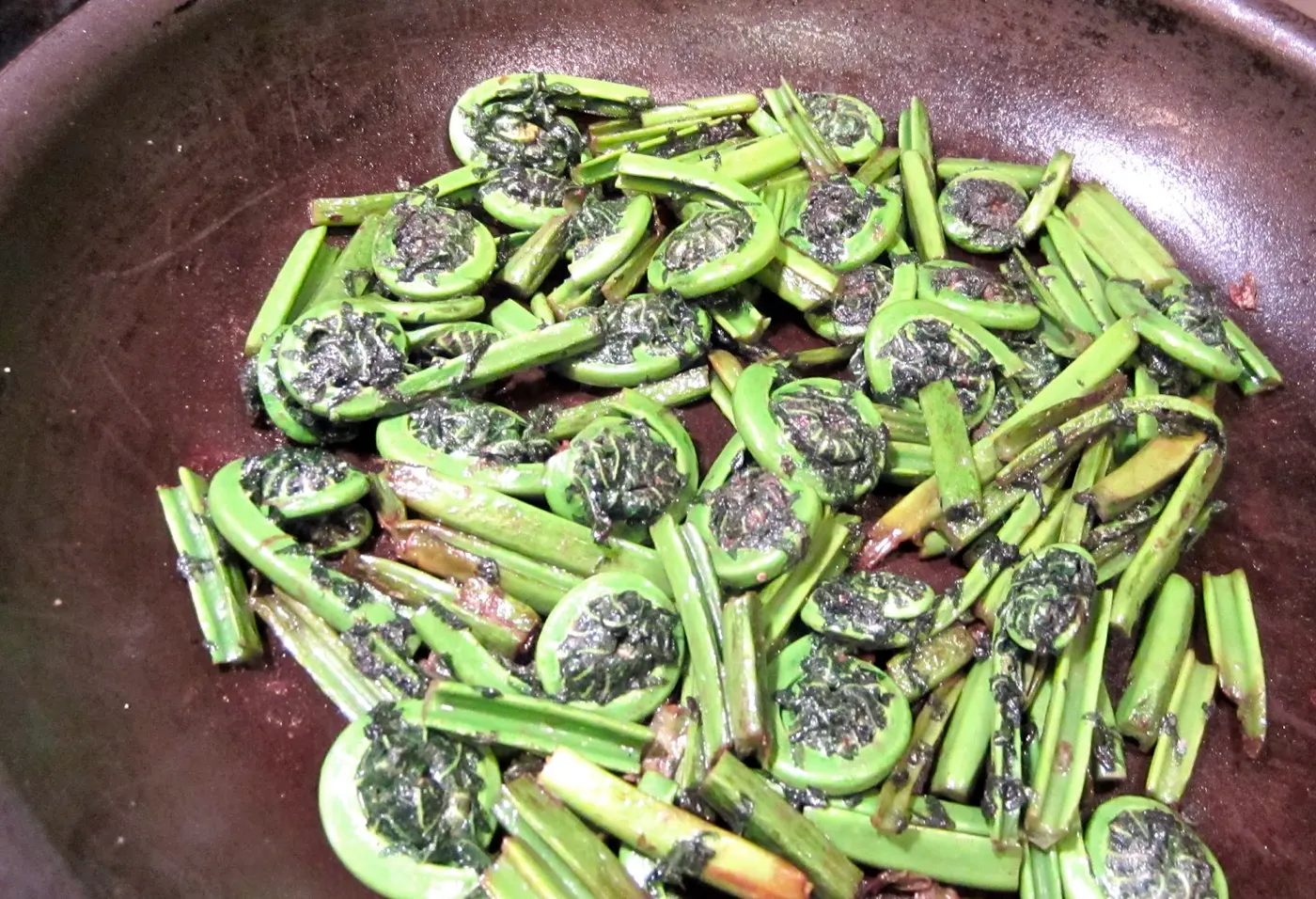 I am posting two recipes from the book, The Taste of Nepal - Neuro ko Tarkaari (Sauteed Fiddlehead Ferns - page 150) and Saandheko Neuro (Fiddlehead Fern Salad - page 151).