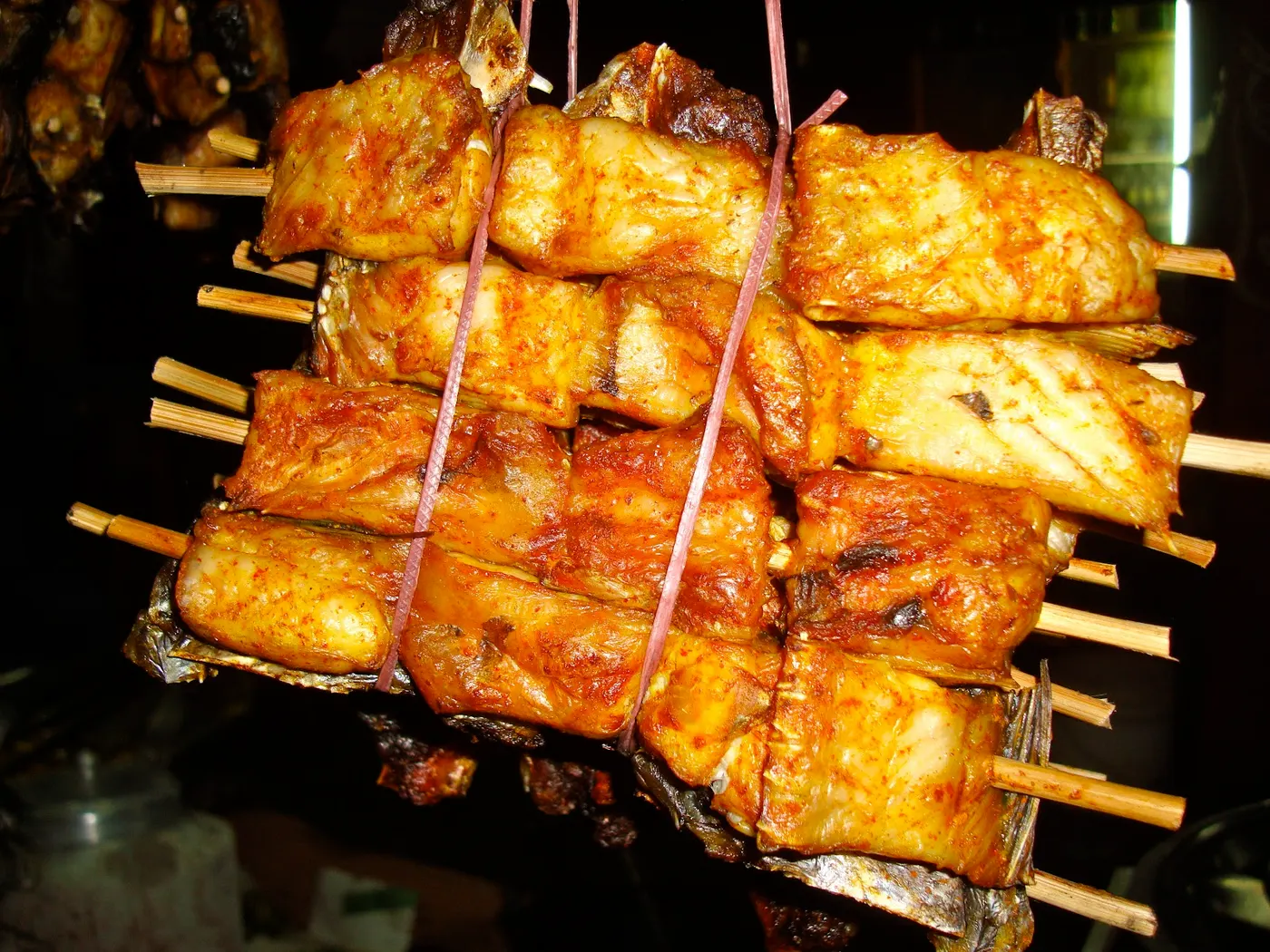 Street vendors selling maachaa ko sukuti (dried fish fillet), preserved without salt.