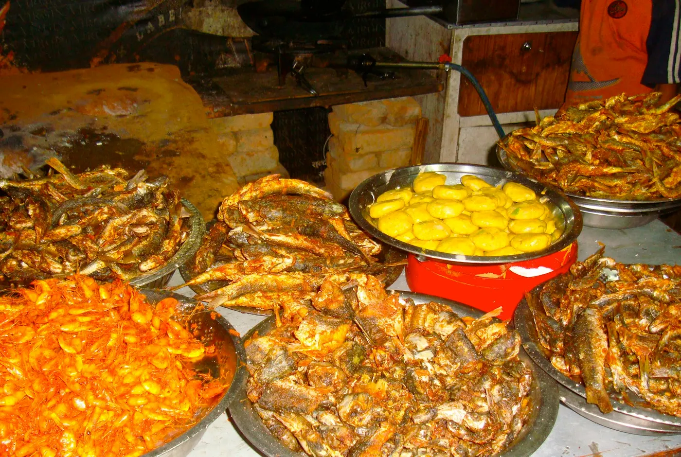 Another beautiful display of fried fish. In the picture, the front left image is jhinge maachaa (crawfish) cooked Nepali style.