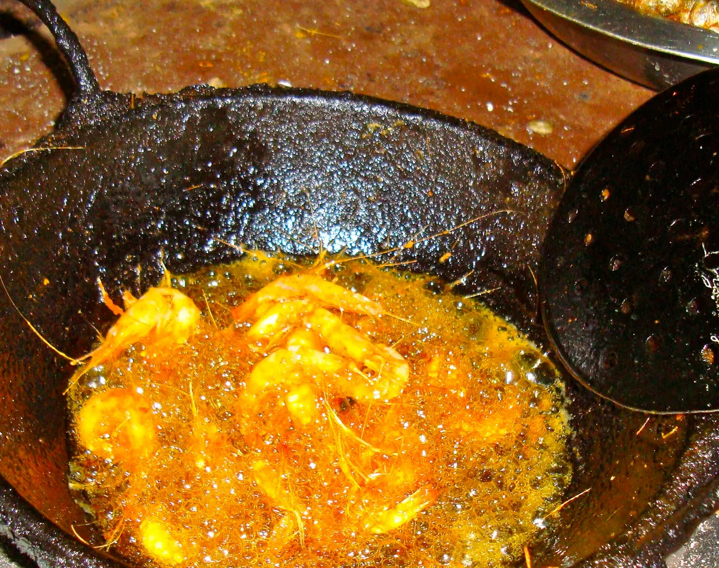 Picture of frying the jhinge maachaa (crawfish) - it is first marinated with spices, then deep-fried until crisp. Do you believe that this fish came from the local river? ....as told to me by the vendor.