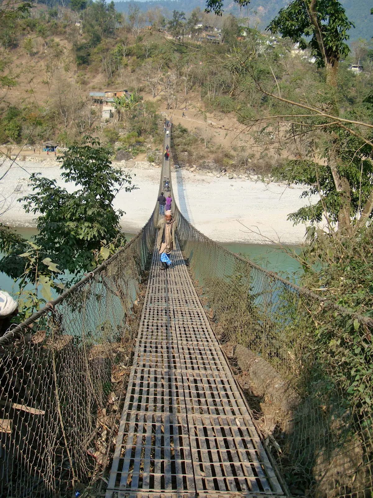 Walking in the Jholunge pool (suspension bridge) - Trishuli river, Kurintar, Nepal