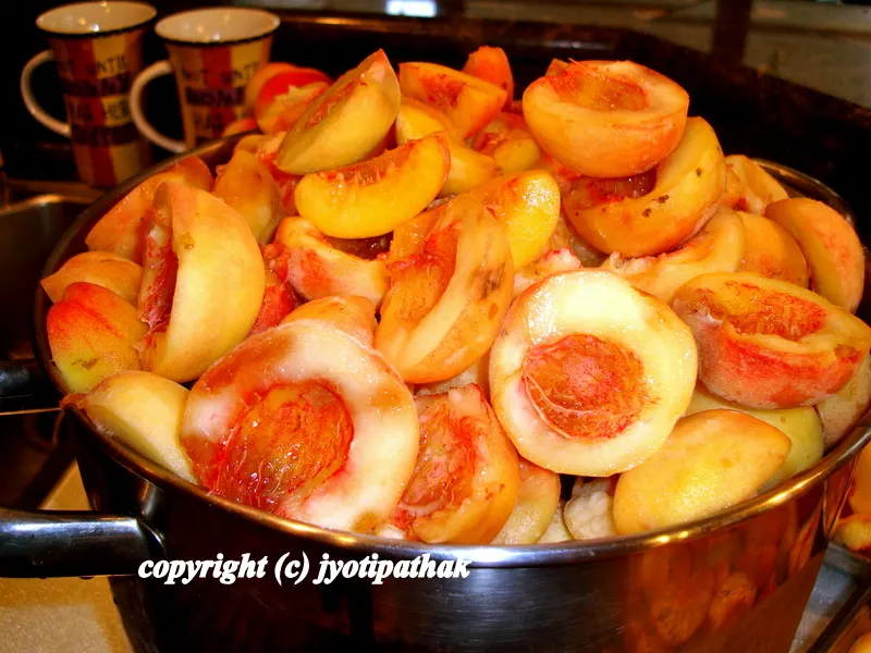 ... placing the fruit in a large and heavy bottomed saucepan...no need to add any water, once the peaches have softened the fruit will give away juice, making it soft and mushy ...