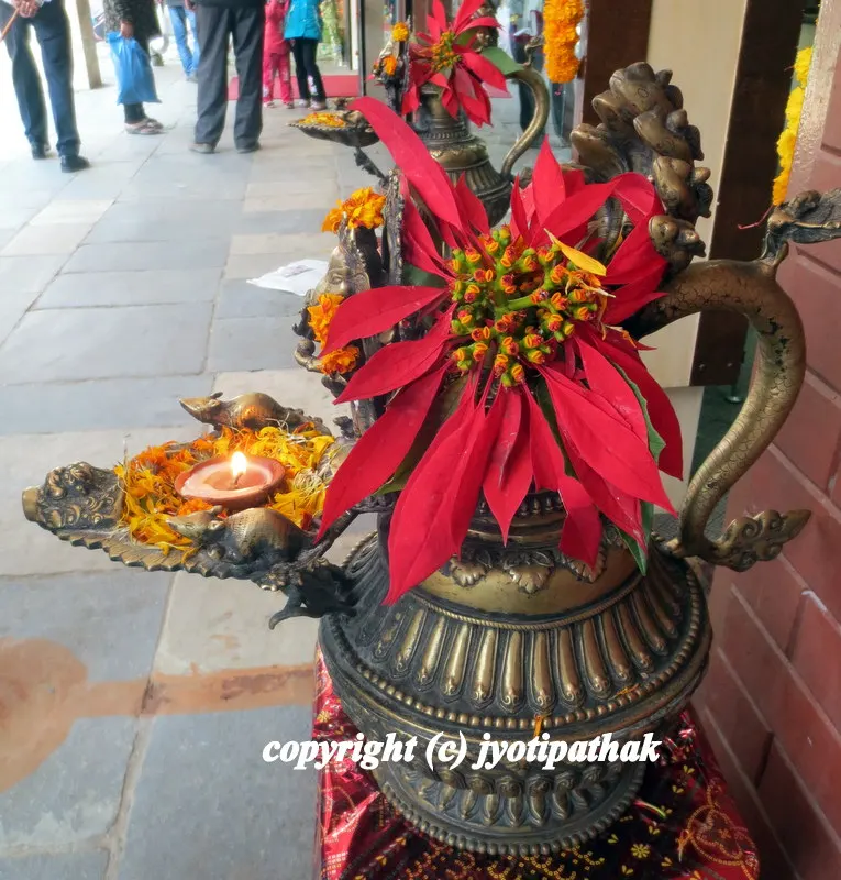 Sukunda - an elaborate oil lamp - stunning brass Sukunda display with exceptionally beautiful flowers of Nepal - this display really catches your eye..
