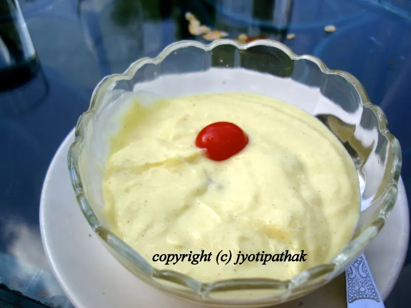 As a variation - serving the creamy sikarni dessert, mixed with pureed mango pulp in an individual bowls topped with a cherry in the middle.