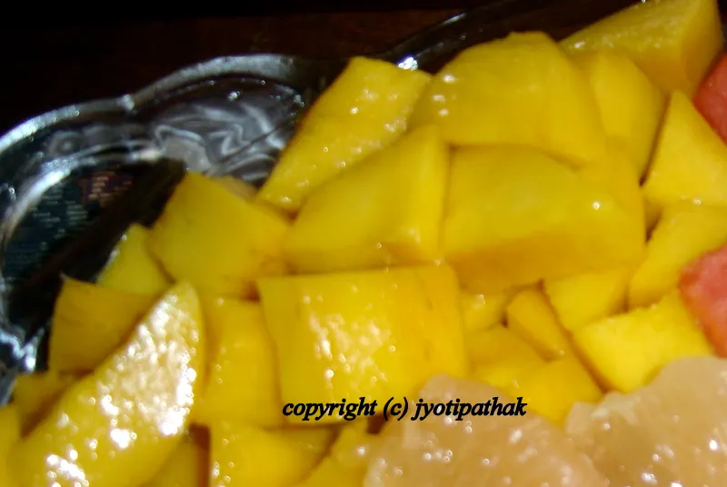 Freshly cut mangoes getting ready to be mixed up with sikarni