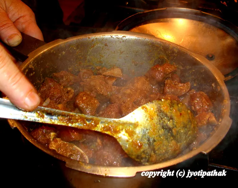 Place the marinated meat in a large heavy-bottomed saucepan. Cook, uncovered, over medium-high heat, stirring from time to time, until the meat loses its pink color and comes to a boil, 7 to 8 minutes.