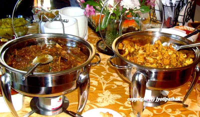 Transferring the meat to a serving dish and serving hot.