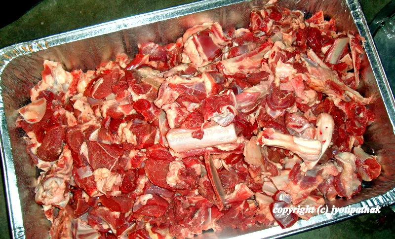 Getting ready to cook a large amount of goat meat for a family feast. In Nepal, meat from the castrated goats is called "khasi ko maasu" and the young tender goat meat is called "bokaa ko maasu".