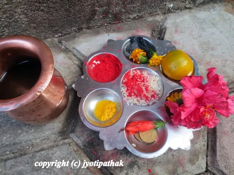 Getting ready to visit temples with Pooja ko Saamagri and holy water (items used during religious offerings)