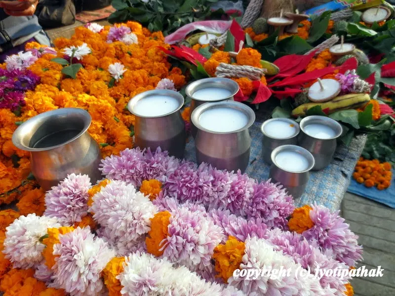 Flower garland, Panchamrit (mixture of milk, honey, sugar, yogurt, gheu), holy water, and other Pooja ko Saamaagri for deities