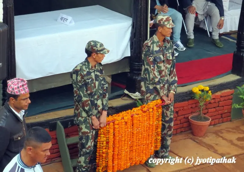 Nepali army, Nepali police, and other police forces in the Kot courtyard - carrying marigold flower garland for the ceremony
