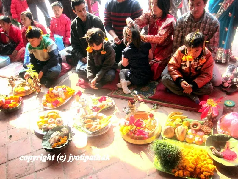 The above two images of group Bratabandha ceremony (journey into manhood) in front of a temple in Kathmandu - Several young boys are receiving sacred thread during the ceremony.