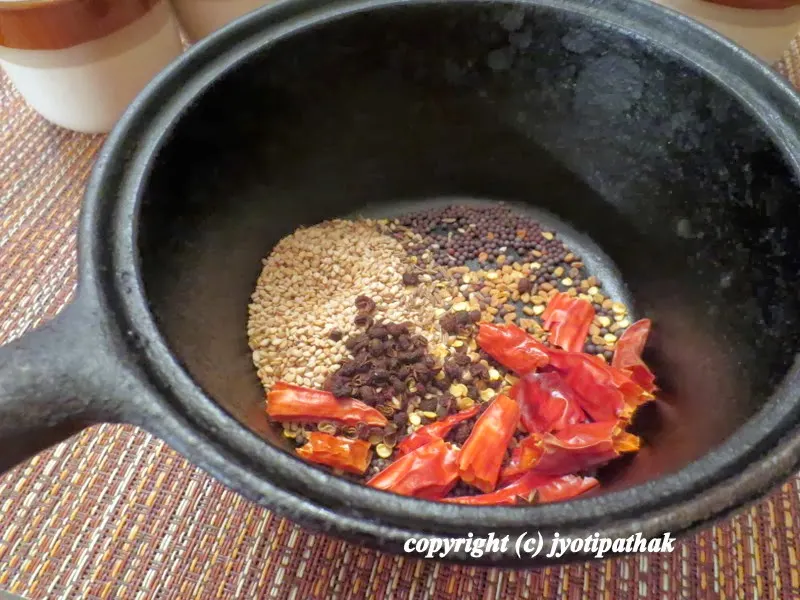 ...place the whole spices in a small cast-iron pan