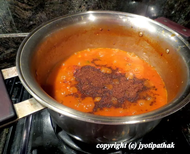 ....mix the dry-roasted and ground spices into cooked tomato.