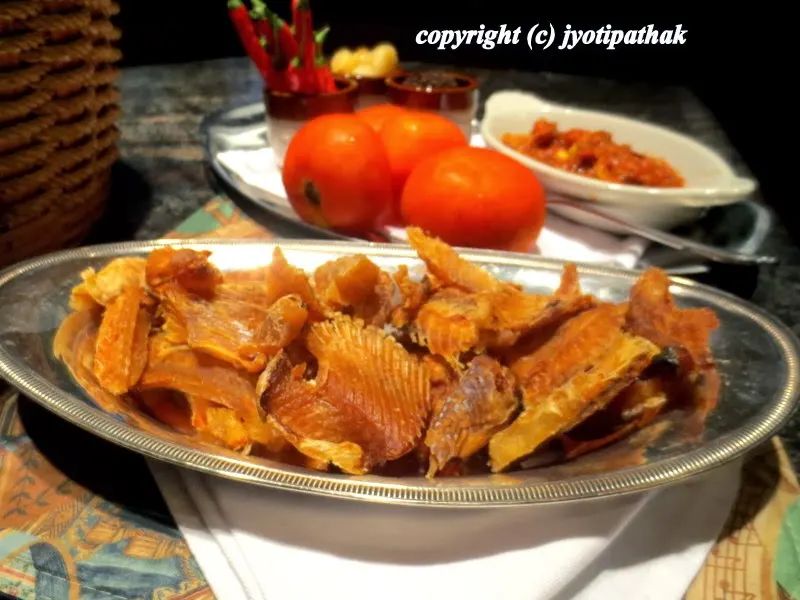 Rich-flavored and delicious home-made fish jerky (trout) made in a food dehydrator.