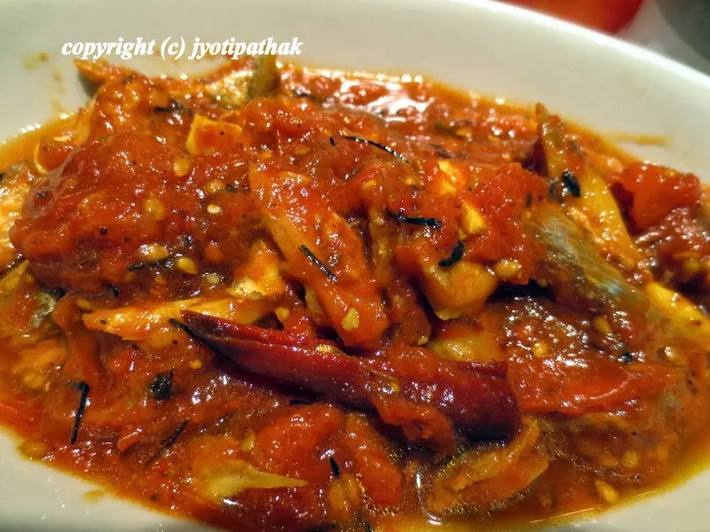 Enjoy the freshly made Tomato Pickle with Sukuti Fish - (गोलभेडा को अचारमा माछा को सुकुटी हालेको)