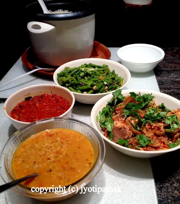 ....start off the dinner with Nepali flavor - consists of rice with the combination of rahar ko daal, fiery tomato chutney with green chilies, pan-sauteed asparagus, and fish curry - all made with minimum spices.