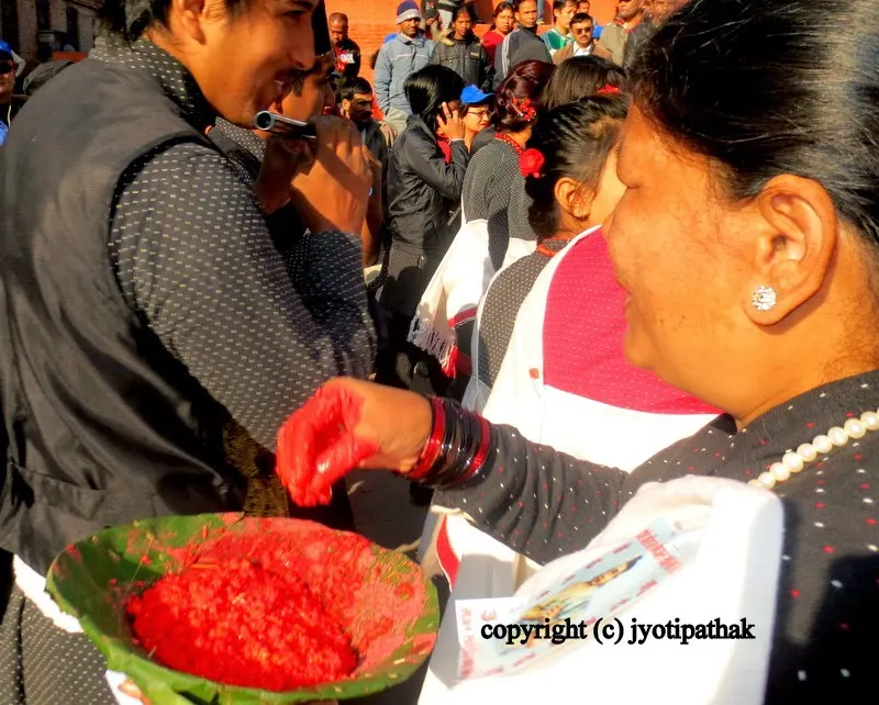 Warm greetings from the lady in black - celebrating and giving tikaa during Nhoodaya Bhintuna (Happy Newari New Year 1132)