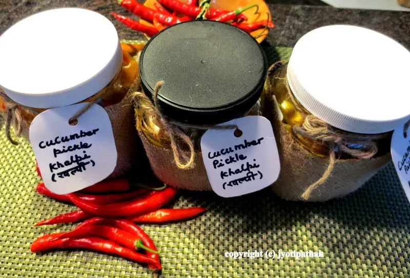 Three jars of pickled cucumber, freshly fermented and ready to eat