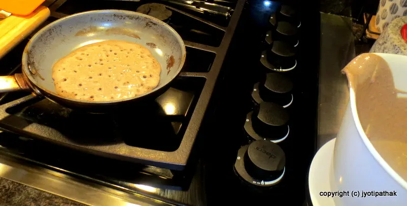 Ladle the batter into pan into the desired size and reduce the heat to medium.
