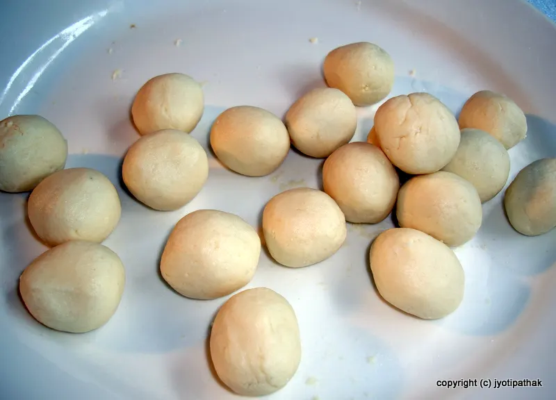 The dough balls will double in size after frying and soaking in sugar syrup